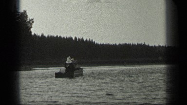 1939: human in a body of water floating in a man made piece of equipment