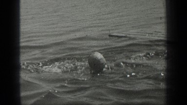 1939: a girl is swimming LONG LAKE CANADA