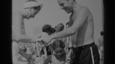 1947: the children enjoying with their family on seashore NEW YORK