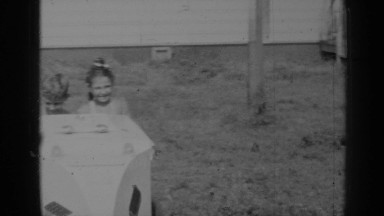 1947: two children pushing around an ice cream cart NEW YORK