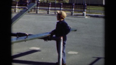 1947: A Boy Playing on a Seesaw at a Park in New York