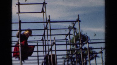 1947: two children playing climbing up and coming down on the rods NEW YORK