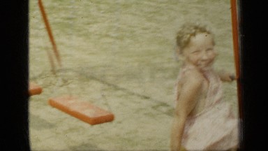 1948: the beautiful boy and girl are sitting on the swing NEW YORK