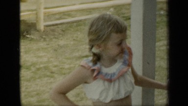 1948: family on the porch enjoying each others company posing for the camera.