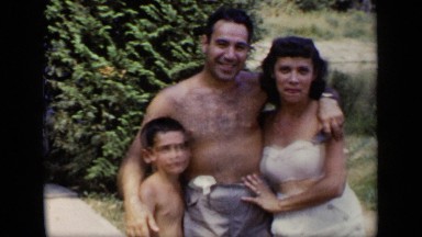 1948: Mother, Father and Young Son in Bathing Suits, Parents Kiss New York
