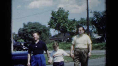 1950: the father and his beautiful sons walking on the roadside NEW YORK