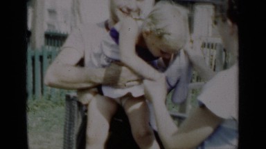 1950: a family in the garden, girl is crying,moving here and ther NEW YORK