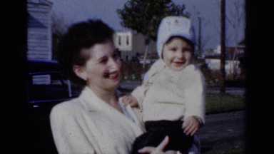 1950: a child being fully happiness with him lovely mom NEW YORK