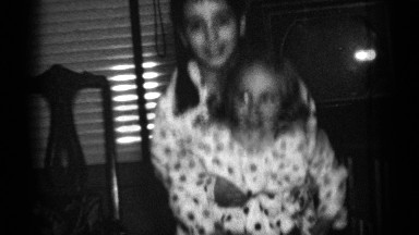 1950: black and white footage of two sisters bouncing in matching pajamas.