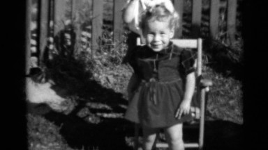 1950: two awesome funny kids playing in the sunlight on the ground NEW YORK