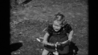 1950: Child Trying to Ride Bicycle Alone in New York