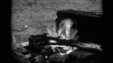 1950: a family gathering at a campfire NEW YORK