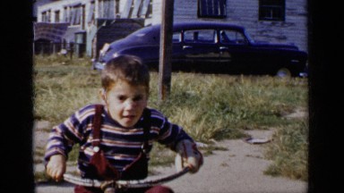 1951: boy coming towards the camera on a bicycle NEW YORK