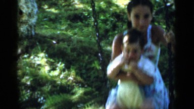 1951: two children sitting on a swing, enjoying their day NEW YORK