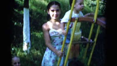 1951: video of kids having fun and slipping on slide in the nature NEW YORK