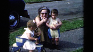 1951: learning to give pose to her children during morning time NEW YORK