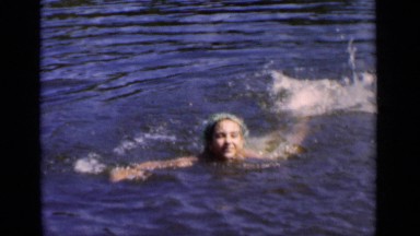 1951: the beautiful girl swimming in the water with her confident NEW YORK