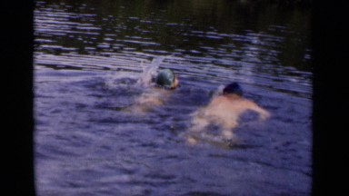 1951: two persons swimming in the river,bathing in the river NEW YORK