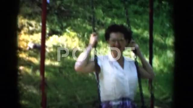 1951: Girl with Water Pistol Hides Behind Sister Before Posing