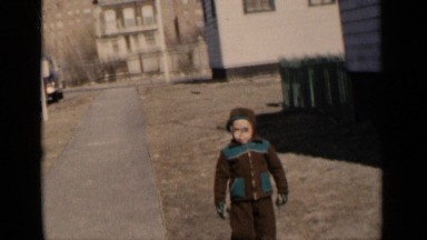 1951: the small boy walking on the roadside who wearing sweater NEW YORK
