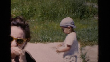 1951: small child is playing near swimming pool in water NEW YORK