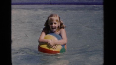 1951: the beautiful child playing in the swimming pool NEW YORK