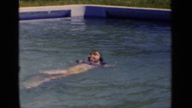 1951: a happy girl swims on a sunny day NEW YORK