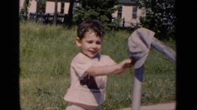 1951: a little child puts the hat on a post NEW YORK
