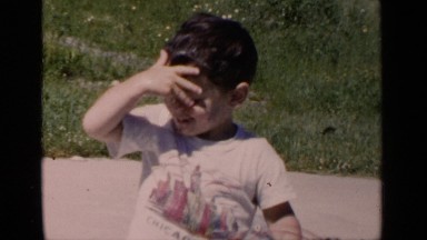 1951: child is pouring water on his head himself NEW YORK