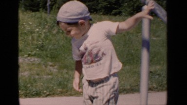 1951: a child in a hat plays outside and talks to the camera. NEW YORK