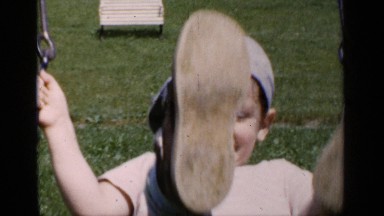 1951: two kinds of girls playing in park with rope and board fittings