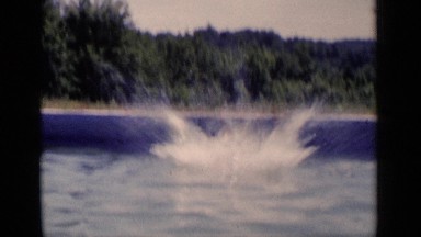 1951: man dives off a jetty into the water and swims toward the camera. NEW YORK