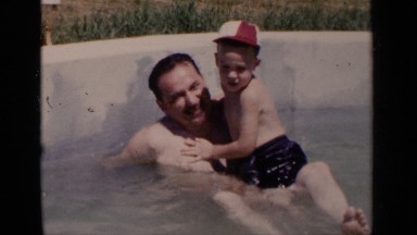 1951: father and son playing in a pool NEW YORK
