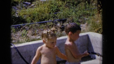 1951: two children are shirtless, with a drawer and kissing NEW YORK