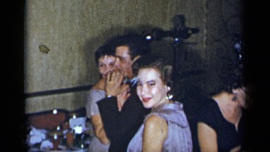 1954: people in suits dancing, having fun, probably in a wedding ceremony
