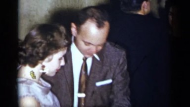 1954: well dressed couple dance at a party with several others. NEW YORK