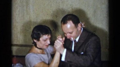 1954: smoking and dancing couple in the 60's NEW YORK