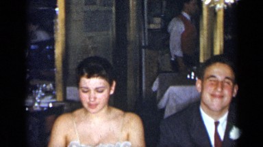 1954: people gathered around dining table NEW YORK