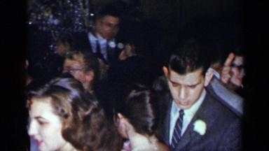 1954: couples standing crowded in a room to participate in an event NEW YORK