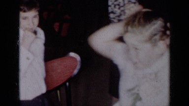 1954: a well dressed boy and girl hamming it up for the camera