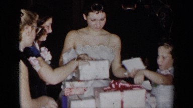 1954: after birthday party is over, they are checking their gifts packs NEW YORK