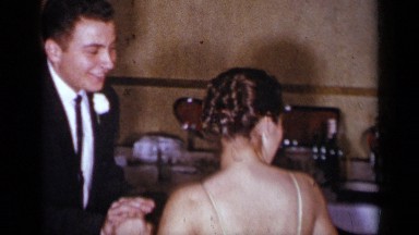 1954: bride and groom carefully navigate the dance floor in a classic setting