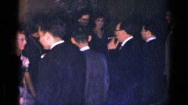 1954: group of men and women in dress clothes dancing at an event NEW YORK
