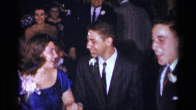 1954: a group of people in formal wear dancing and laughing at a party. NEW YORK