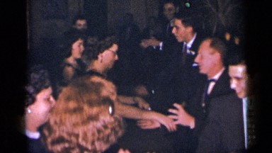 1954: the group of people are gathered NEW YORK