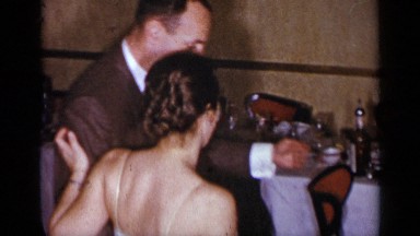 1954: lovely couple dancing to the music on a celebration party or a wedding