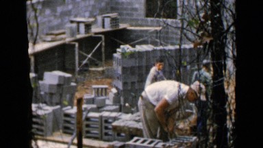 1957: Men Work Outdoors on a Building Construction Site in Birmingham Alabama