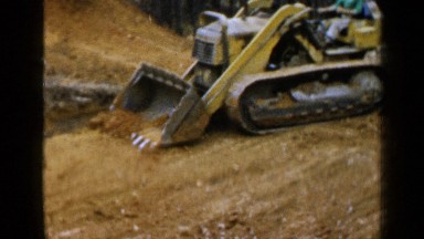 1957: using a huge machinery on wheels the soil being prepared for construction