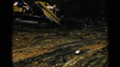 1957: loader machine moving wood BIRMINGHAM ALABAMA