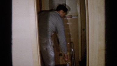 1957: a man working in a room with tile walls. BIRMINGHAM ALABAMA